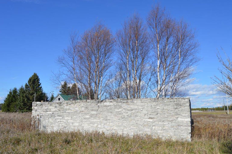 Where settlers worked hard and a barn once stood.